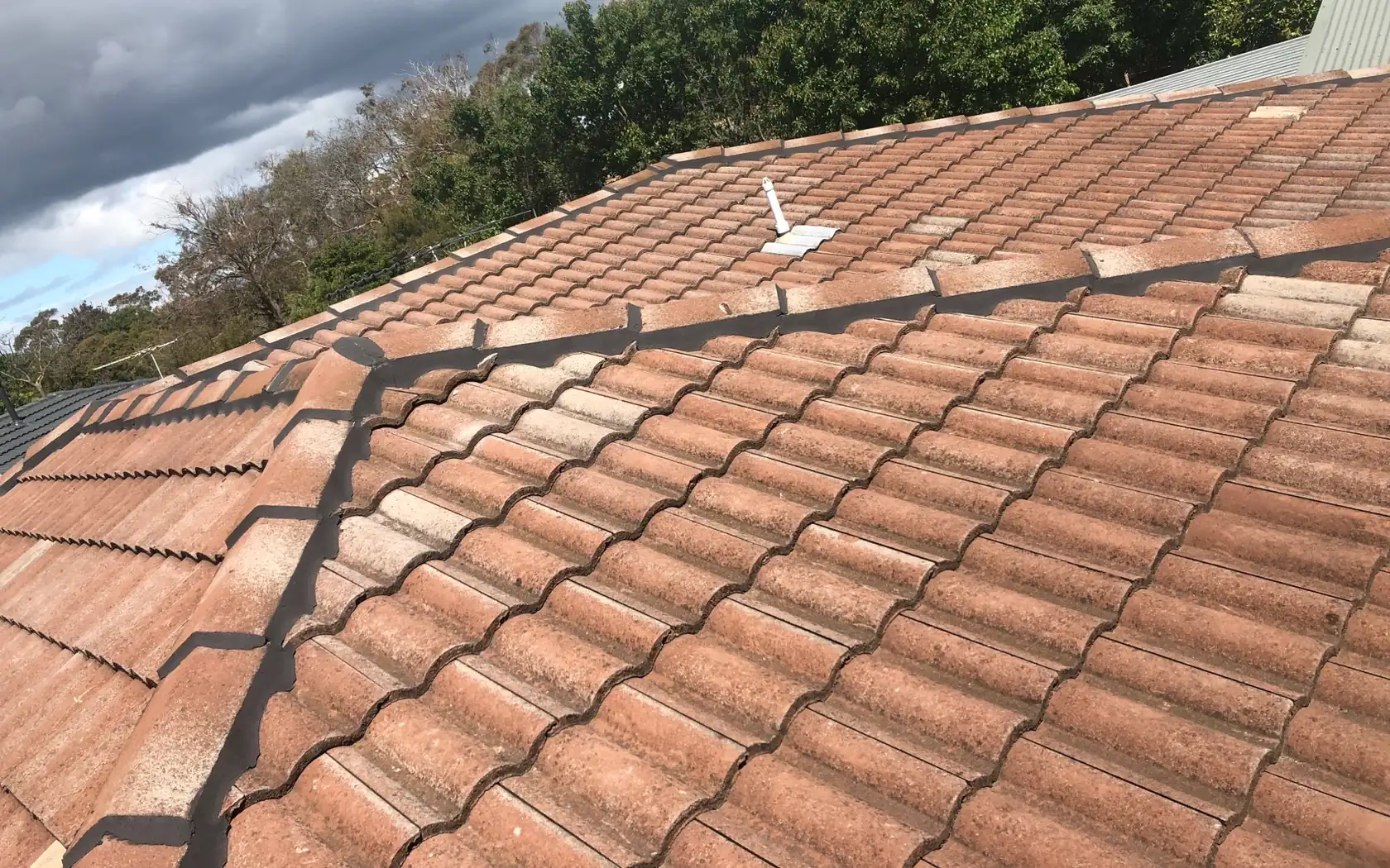 Repointed ridge capping on a tiled roof in Mornington