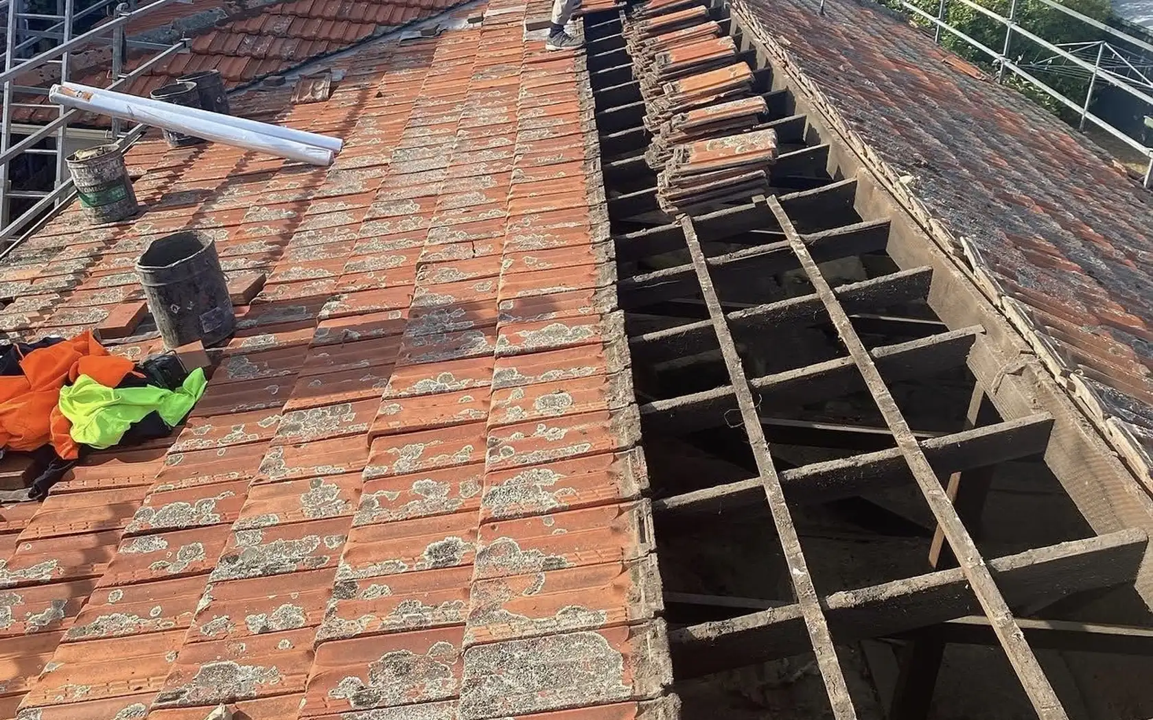 Roofer repairing a tiled roof in Mornington